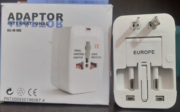 Producto - Adaptador Universal Viajero Cualquier Enchufe Europa Uk