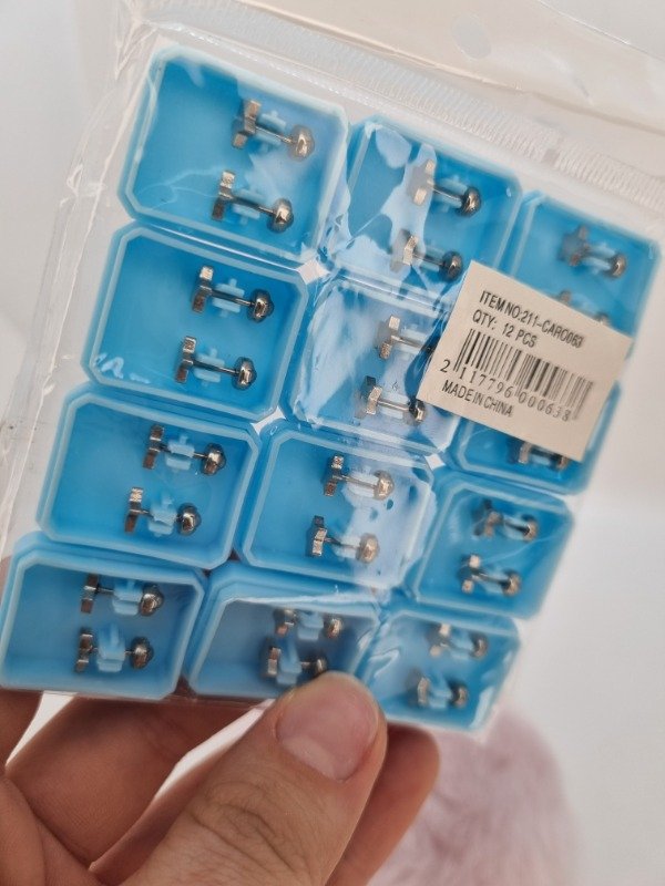 Producto - Blister abridores acero quirurgico x12 pares estrella plana