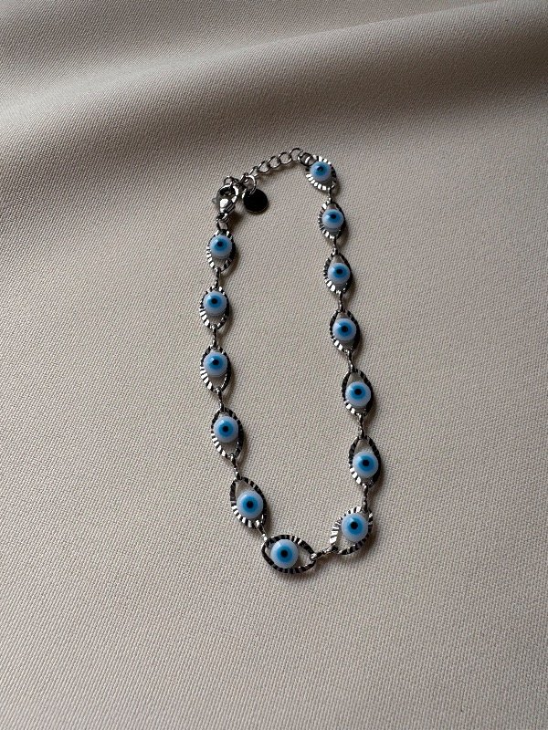 Producto - Pulsera ojo protector celeste - Acero quirúrgico