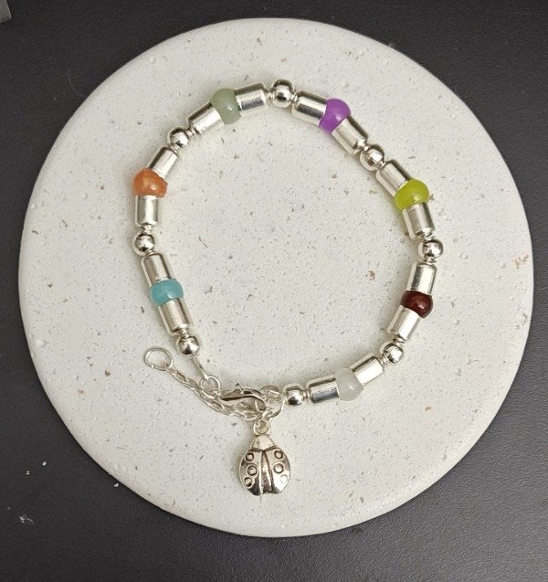 Producto - Pulsera con Piedras Cristal Pelotitas, Tubitos con dije Vaquita San Antonio