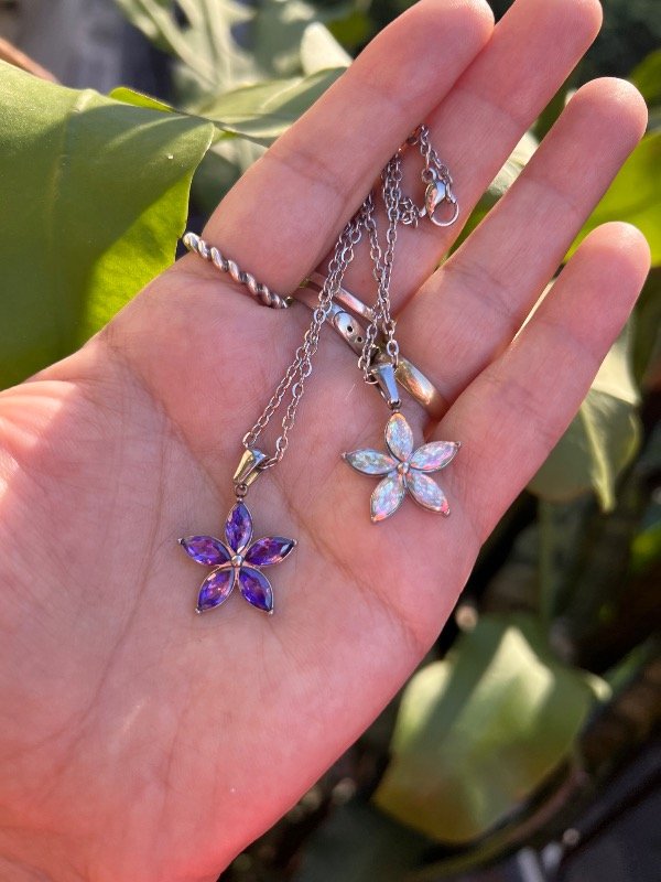 Producto - 2 collares de acero flor violeta y tornazol