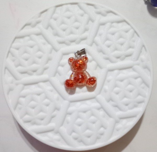 Producto - Dije resina osito naranja