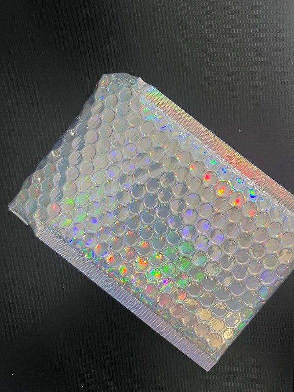 Producto - 10 sobres doble burbujitas tornasolado pegamento y sticker de regalo 15 x 13 cm