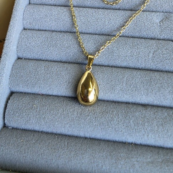 Producto - Dije Ac. Dorado en forma de gota lisa