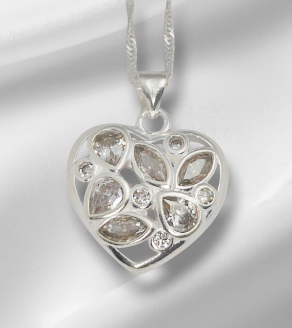 Producto - DIJE CORAZON CALADO