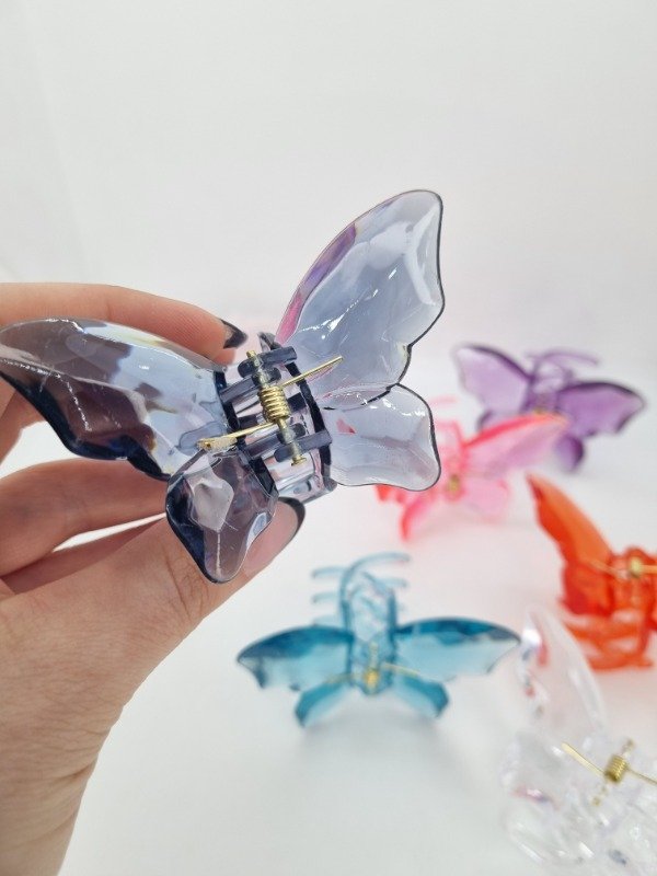 Producto - Broche plastico mariposa color transp