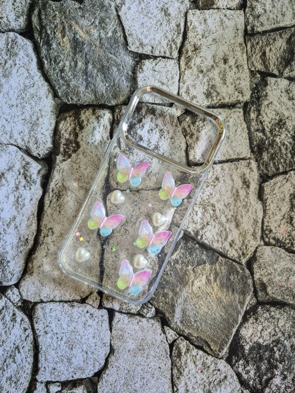 Producto - Funda charms mariposa Iphone 17 Pro