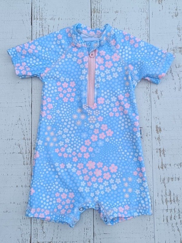 Producto - ENTERITOS UV MANGA CORTA FLORCITA PASTEL