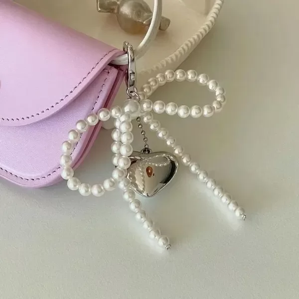 Producto - Llavero perlas moño corazon plateado