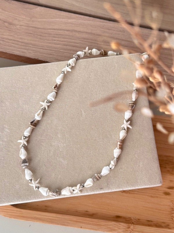 Producto - collar caracolitos y estrellitas marron