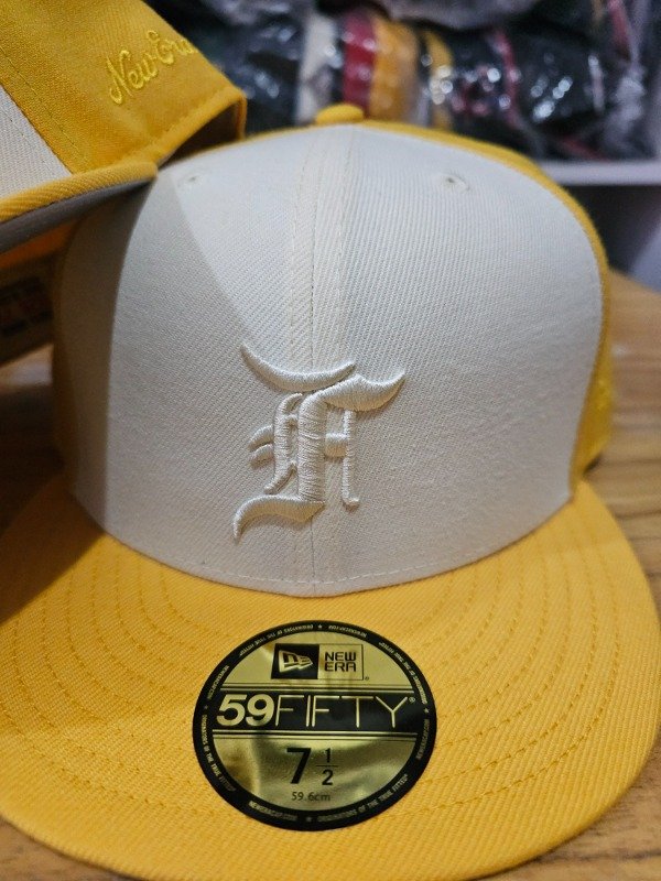 New era fear of god essentials yellow