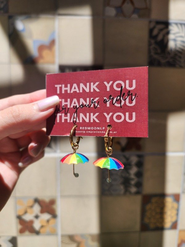 Producto - Argollitas Rainbow Umbrella ACERO QUIRÚRGICO