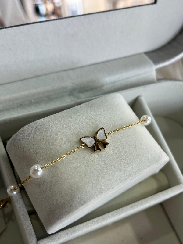 Producto - Pulsera moño dorado
