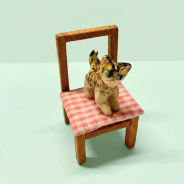 Producto - miniatura en sillita x verdeagua