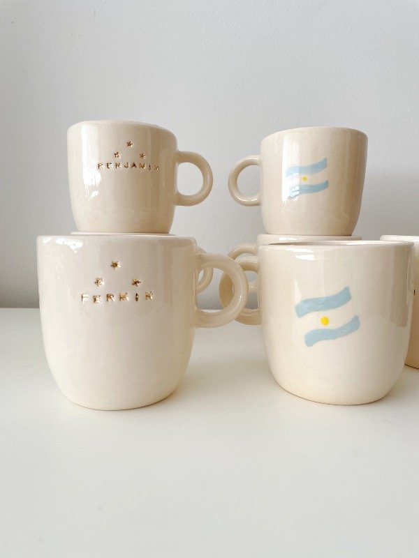 Producto - Set de 2 tazas mundial con oro