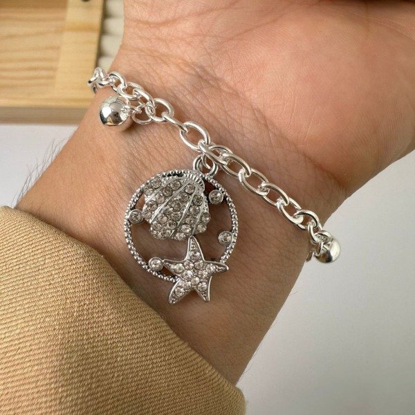Producto - Pulsera dije Circular ostra y estrella y pecesito