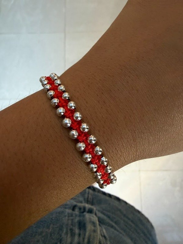 Producto - Pulse hilo rojo