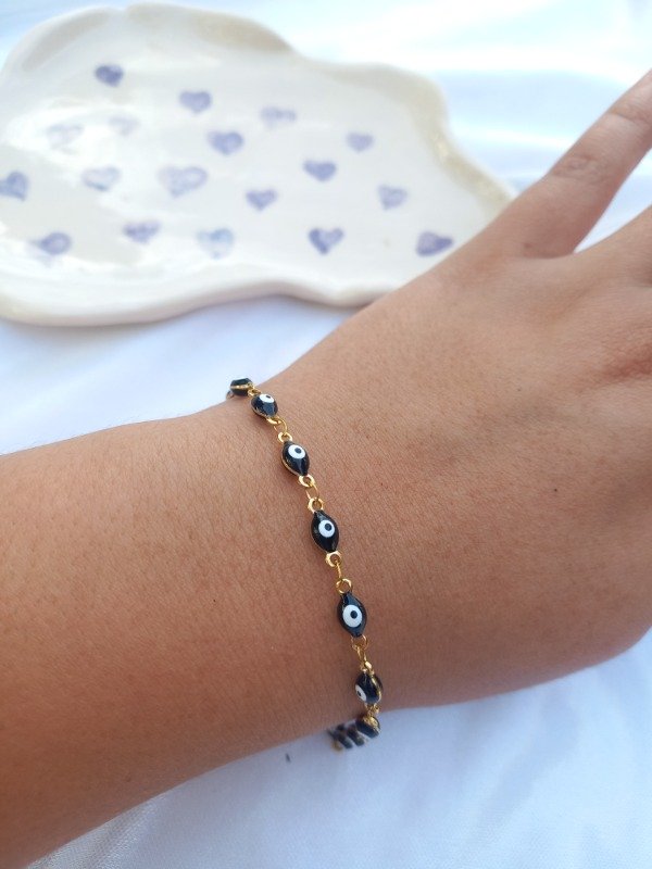 Producto - pulsera ojitos golden (negro)