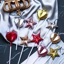 Producto - VELAS CORAZON Y ESTRELLA FACETADAS METALIZADA CON PALITO