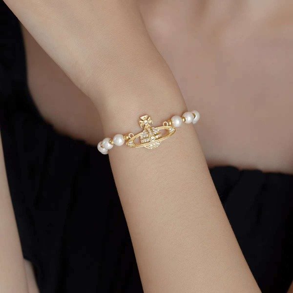 Producto - pulcera de perlas con dije de satur