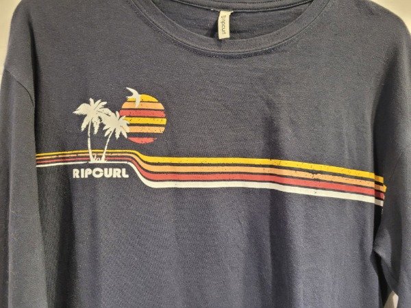 Producto - Remera RIP CURL negra rayas y logo manga larga- Talle 18 años- PRECIO: 10X - 1