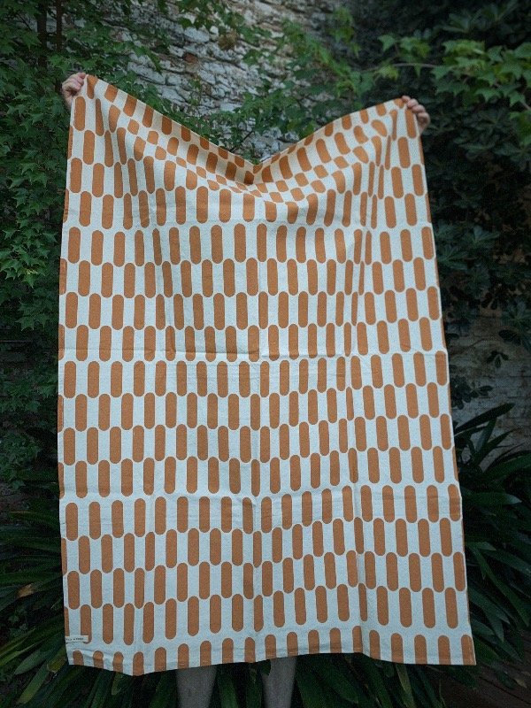 Producto - LONA CÁPSULAS MARRÓN