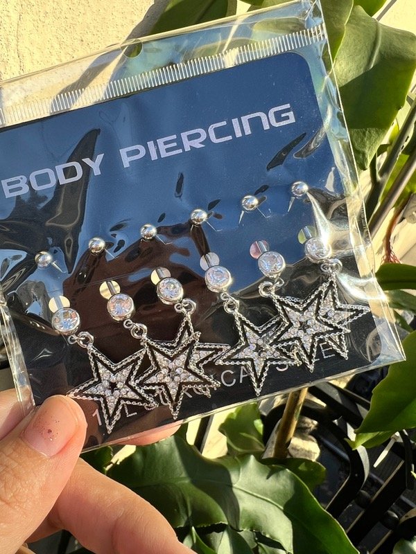 Producto - Blister de piercing de ombligo con estrellas brillosas