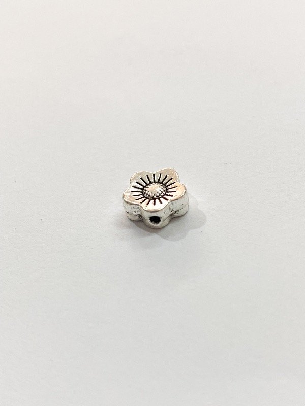 Producto - Mini dije flor pasante