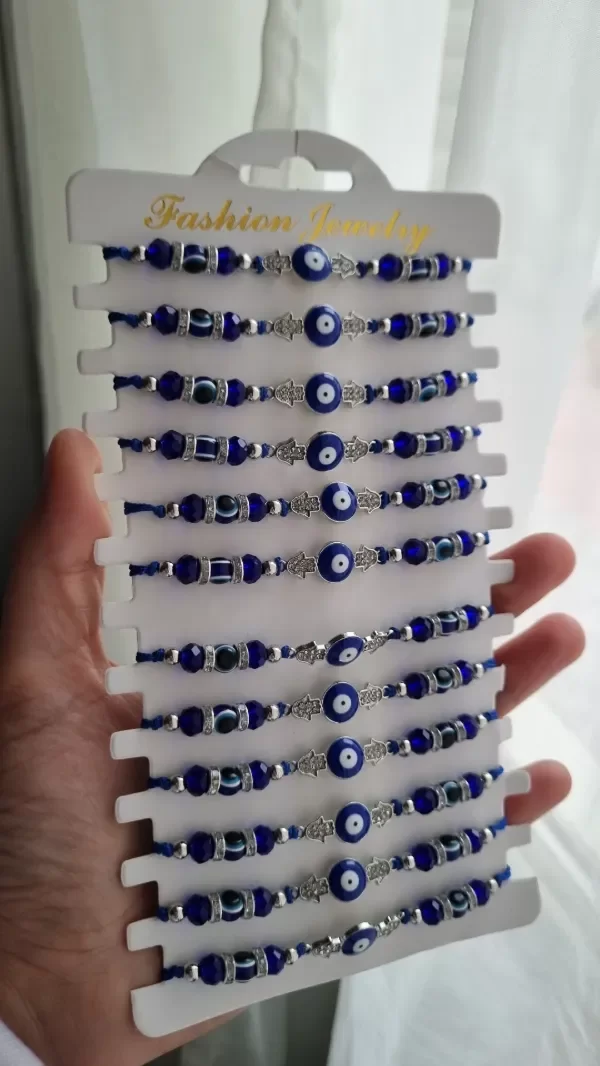 Producto - Pulseras regulables hilo azul con ojitos y manito de fatima