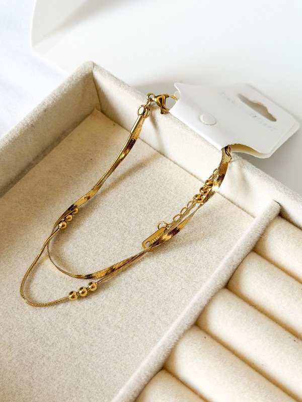 Producto - Pulsera doble plana con bolitas-acero dorado