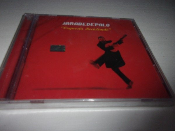 Producto - CD JARABE DE PALO ORQUESTA RECICLANDO NUEVO ARG C1