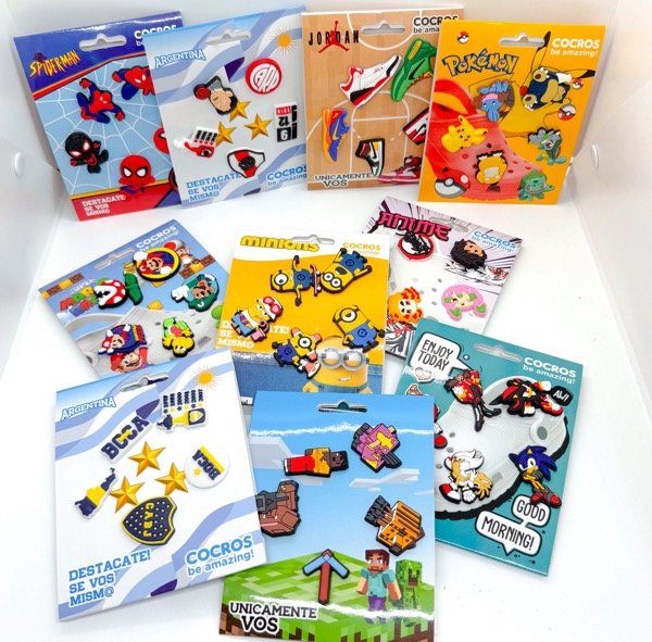 Producto - Pines para crocs surtido caja x12u (50 modelos)