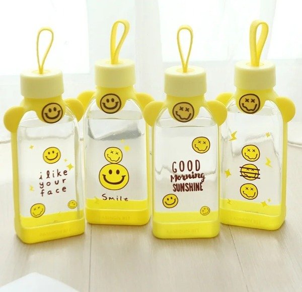 Producto - BOTELLAS DE VIDRIO Y AGARRADERA DE SILICONA OSITO AMARILLO - WINNIE THE POOH