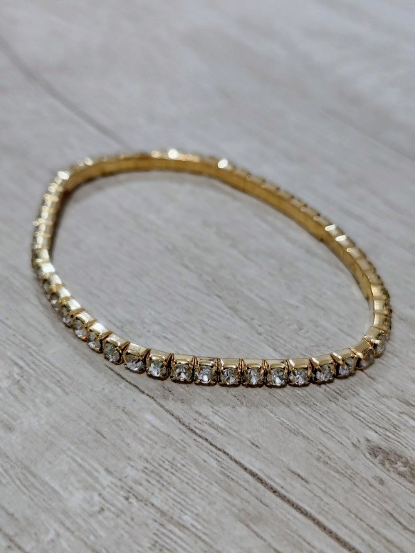 Producto - Pulsera elástica dorada con brillos plateados