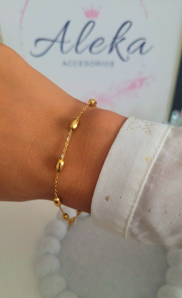 Producto - Pulsera bolita ovalada de acero dorado