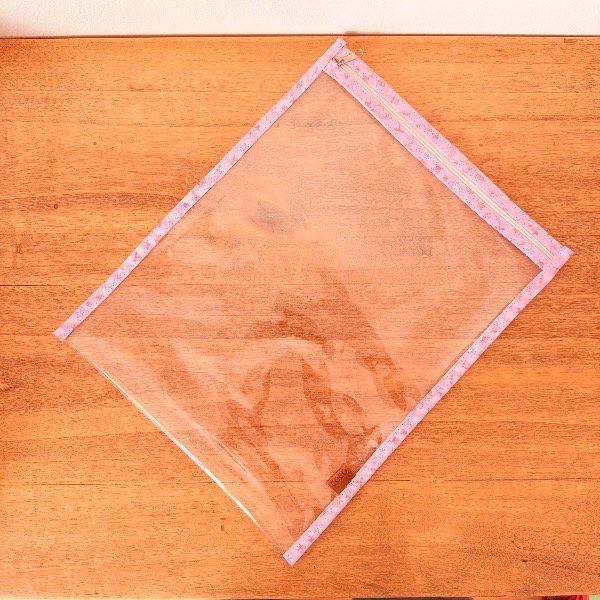 Producto - SOBRE CRISTAL A4 CON CIERRE Rosa con dibujitos