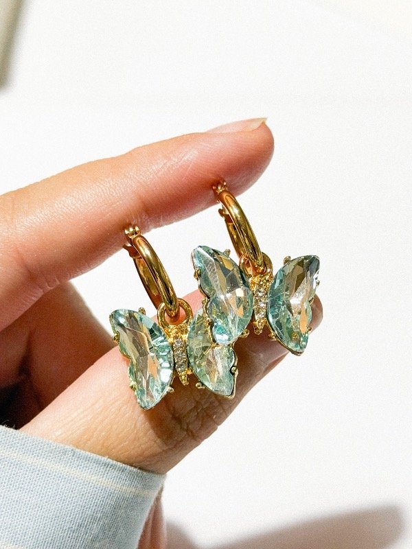 Producto - Argolla mariposa celeste cristal-acero dorado