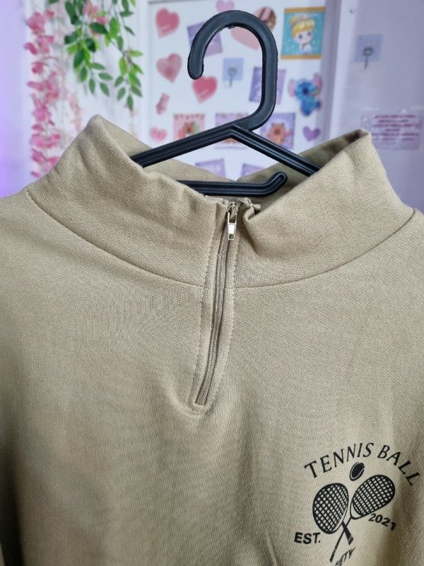 Producto - Buzo Tennis Ball Beige Falla - 1
