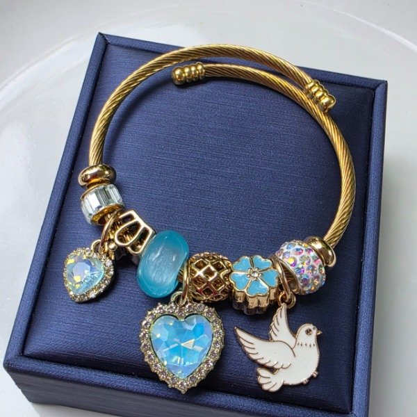 Producto - Brazalete acero dorado paloma