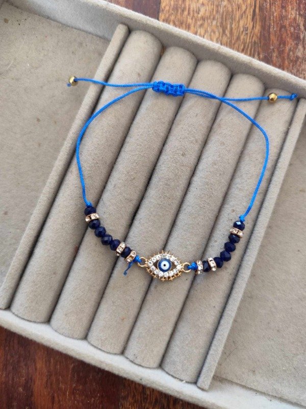 Producto - Pulsera hilo ojito azul.