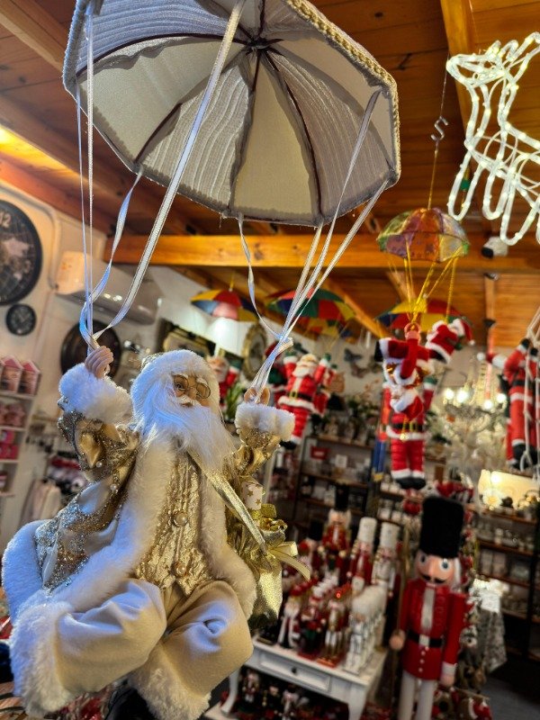 Producto - Papá Noel en paracaídas dorado (con movimiento y música) (Efectivo: 137.200)