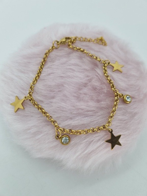 Producto - Pulsera acero dorado dijes puntito strass y formas lisa