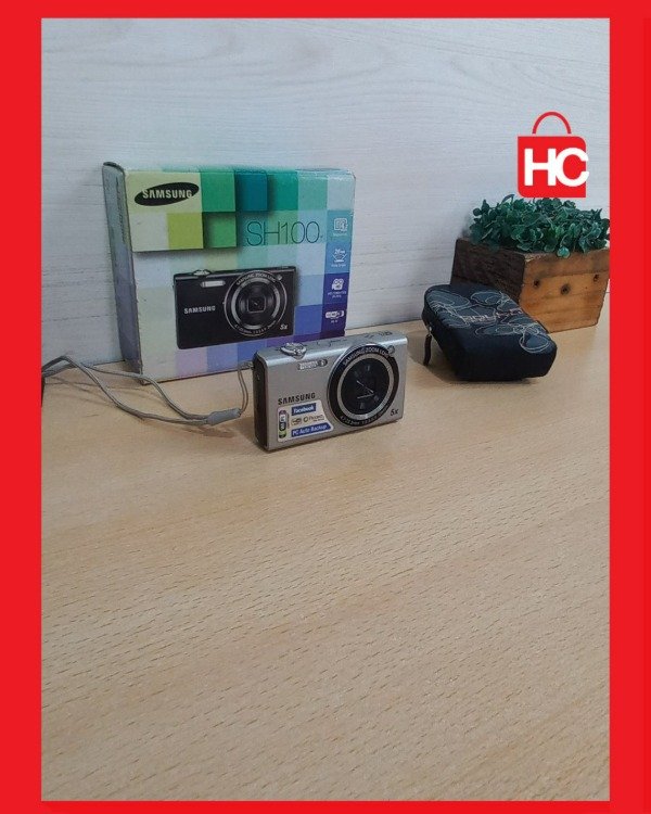 Producto - Cámara digital compacta Samsung SH100 con Wi-Fi - Completa con caja y funda - 1