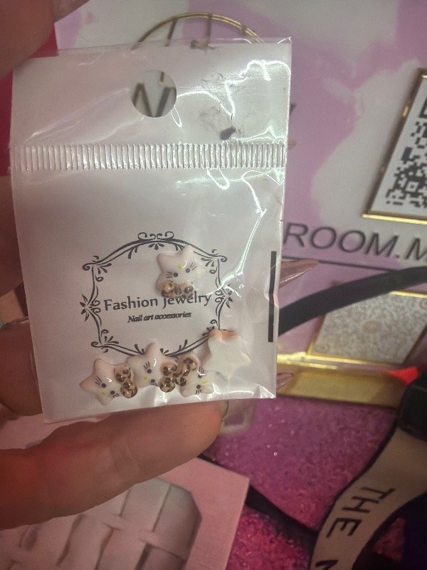 Producto - Aplique estrellita con moño animal print