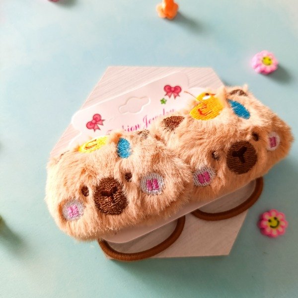 Producto - PAR COLITAS CAPY PELUCHE