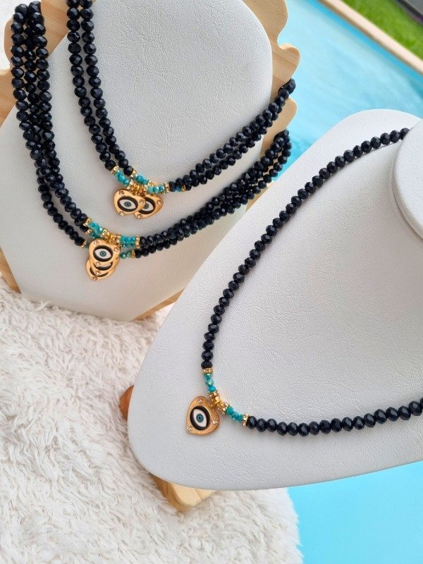 Producto - COLLAR CRISTAL CENTRO AQUA Y CORAZON CON OJITO Y STRASS