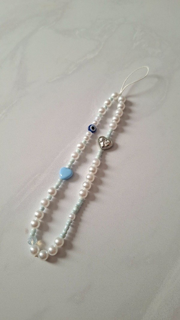 Producto - Strap Phone perlado corazon celeste