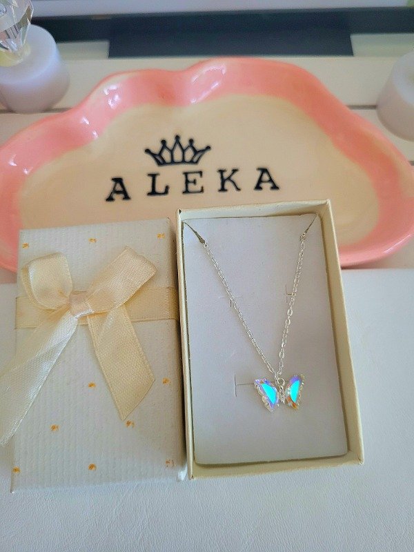 Producto - Collar mariposa tornasol de acero blanco