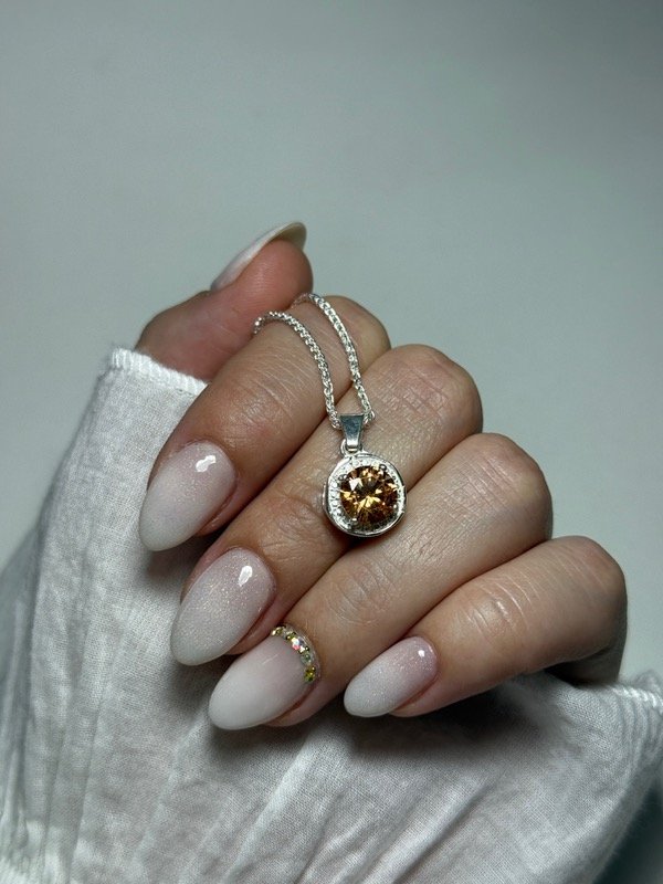 Producto - Dije piedra dorada circular - 0