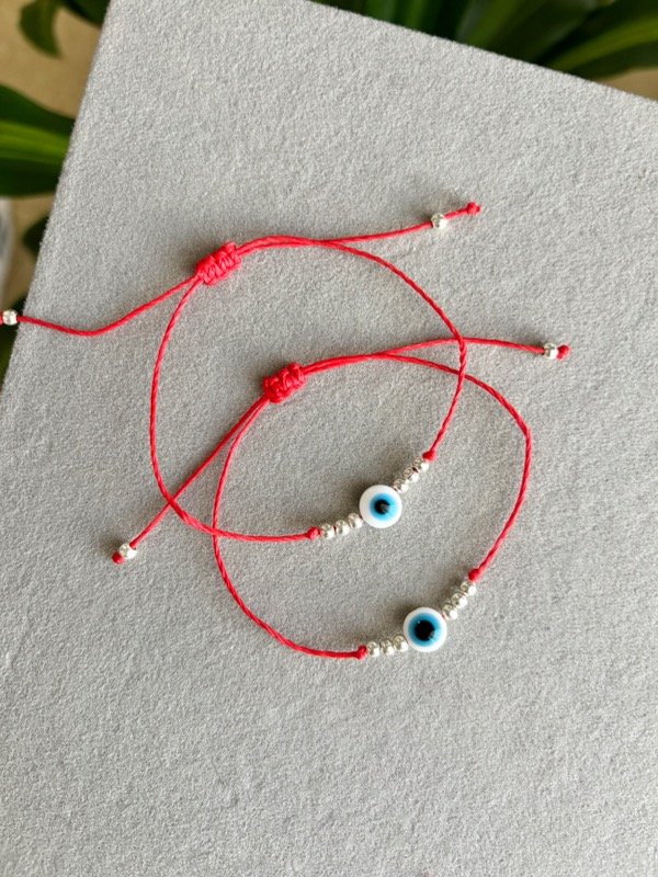 Producto - Pulsera Amuleto Ojo Turco Hilo Encerado Rojo y Acero Blanco